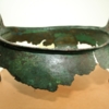 Fragments of a broken Anglo-Saxon bronze bowl