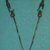 Pair of linked silver pins set with garnets